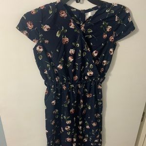 Navy romper with a flower print